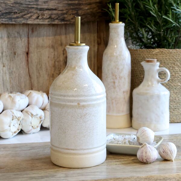 Bottle with bottle pourer, cream